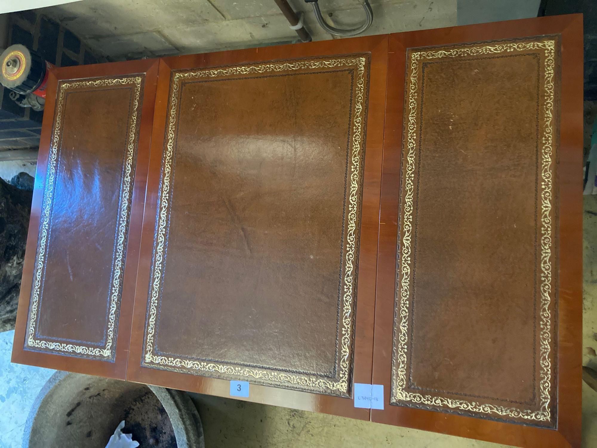 A modern yew wood and mahogany writing table, with sliding backgammon and chessboard top, width 92cm